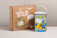 A cardboard box and a white plastic bucket with a handle, both branded Mobilo and labeled ECO Team / ECO Builder, photographed on a light neutral surface against a beige wall.